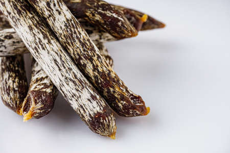 meat sausages with white mold on a white acrylic background.の写真素材