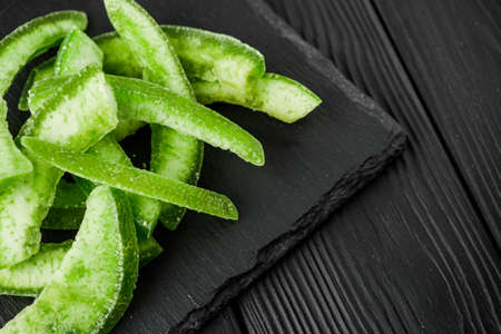 pomelo citrus on a black wooden rustic background.の写真素材