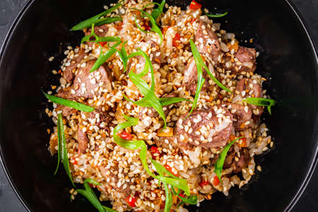 traditional Chinese fried rice on black background.