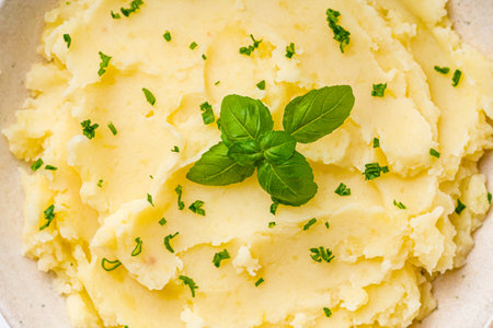 fresh tasty mashed potatoes on a white wooden rustic background.の写真素材