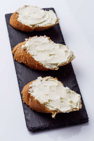 baguette cream cheese sandwich on a white background.