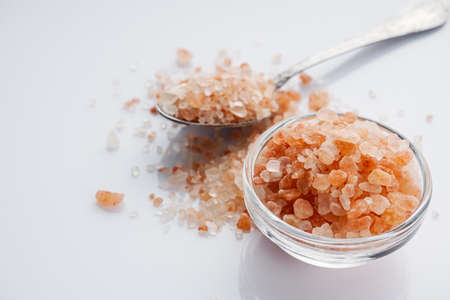 pink Himalayan salt on a white background.