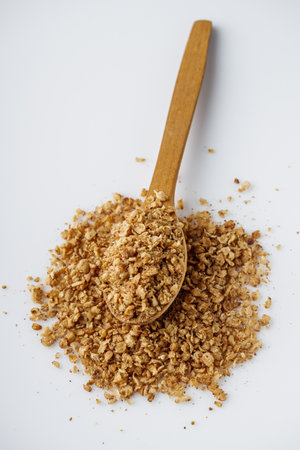 fresh raw buckwheat flakes on a white background.の写真素材