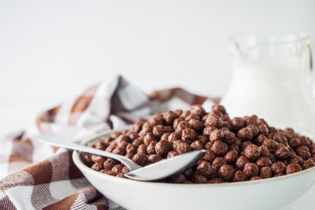 sweet crunchy chocolate children's breakfast chocolate balls on a white background.