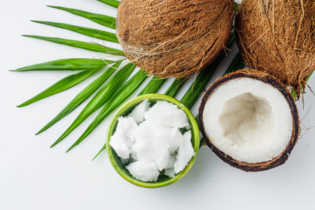 fresh natural coconut oil on white acrylic background.の写真素材
