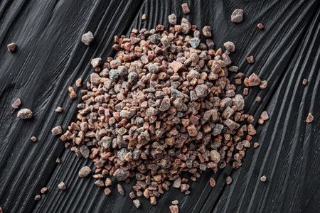 crystalline black Himalayan salt on a black wooden background.の写真素材