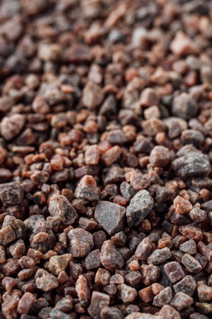 crystalline black Himalayan salt on a white background.の写真素材
