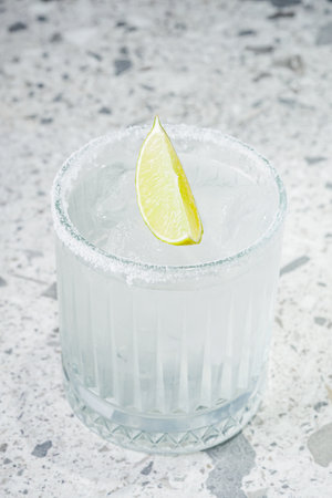 margarita cocktail on a gray stone bar counter.の写真素材