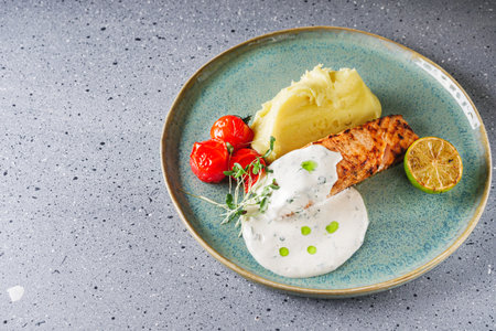 delicious grilled salmon steak with cream sauce.の写真素材