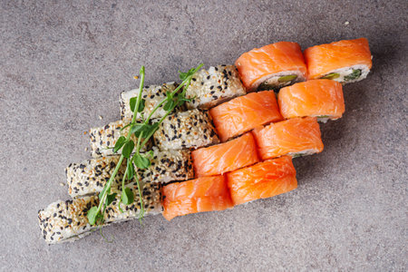 delicious fresh sushi roll philadelphia cheese with salmon eel cucumber and avocado.の写真素材