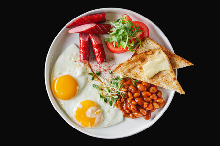 delicious traditional english breakfast on a white plate.の写真素材