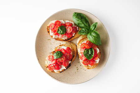 delicious Italian bruschetta with tomatoes on a white background.