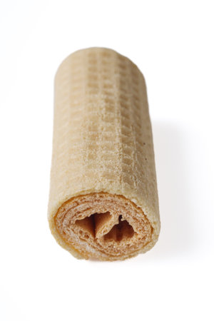 crispy dessert waffle rolls on a white backgroundの写真素材