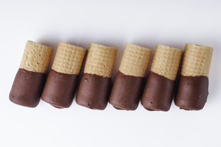 crispy dessert waffle rolls on a white backgroundの写真素材
