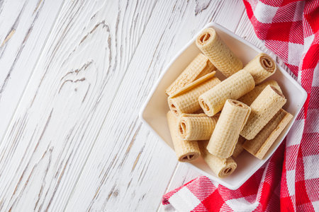 crispy dessert wafer rolls on a white backgroundの写真素材