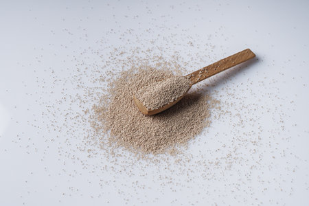Granulated dry yeast on a white background.の写真素材