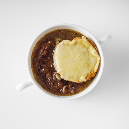 delicious original French onion soup on a white background.の写真素材