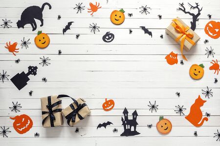 Background with Halloween decoration on white wooden table. Blank space for text. Festive; concept.の写真素材
