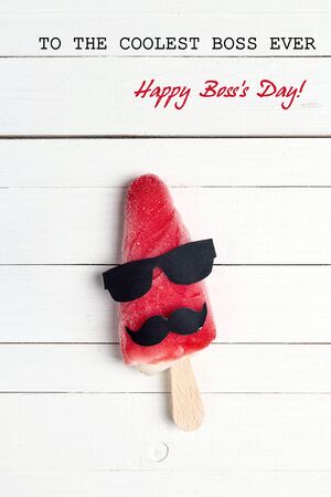 Boss's day greeting card with funny ice cream on white wooden background. To the coolest boss ever!の写真素材