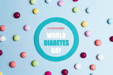 World diabetes day concept with symbol of diabetes and sweets on blue background.の写真素材