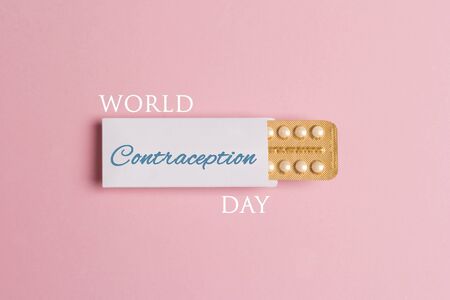 World Contraception Day Poster; September 26. Female oral contraceptive pills blister on pink background.の写真素材
