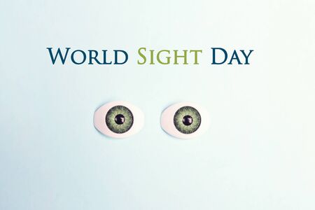 World sight day poster with decorative eyes on a blue background. International october holiday.の写真素材