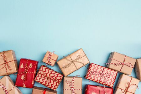 Christmas gift boxes and copy space on blue background. Top view.