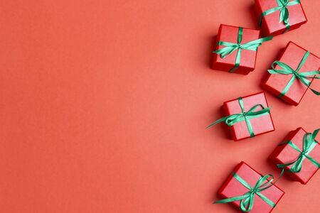 Christmas gift boxes and copy space on red background. Top view.の写真素材