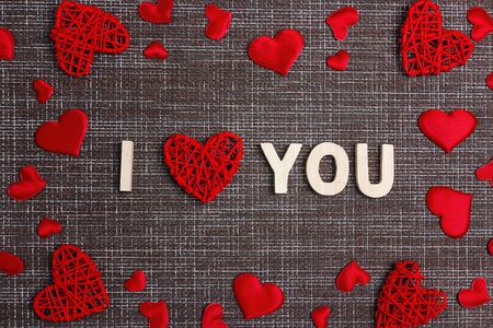 Declaration of love with  decorative hearts on sackcloth background. Space for text. Valentine's day...