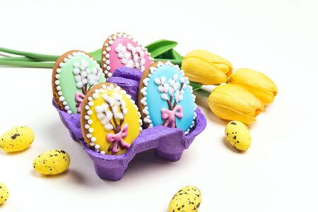 Easter homemade gingerbread cookies on a light background. Gingerbread in shape of easter eggs.
