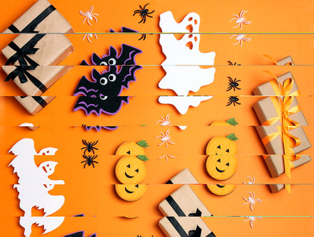 Halloween orange background with spooky funny decorations and gifts. top down composition.の写真素材