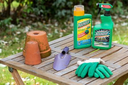 Paris, France - August 15, 2018 : Herbicide on a wooden table in a french garden. Roundup is a brand-name of an herbicide containing glyphosate, made by Monsanto Company.のeditorial素材