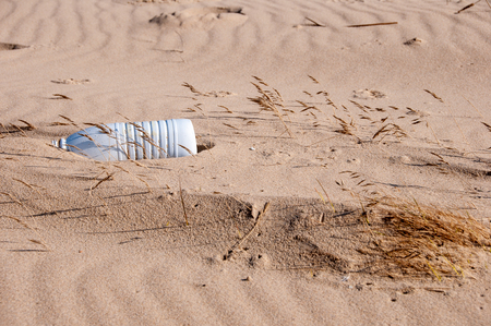 Plastic bottle washed up on a beach.の写真素材