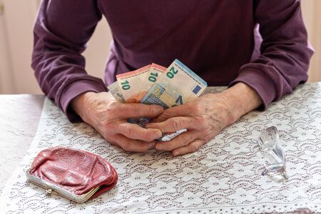 Old lady with her savings