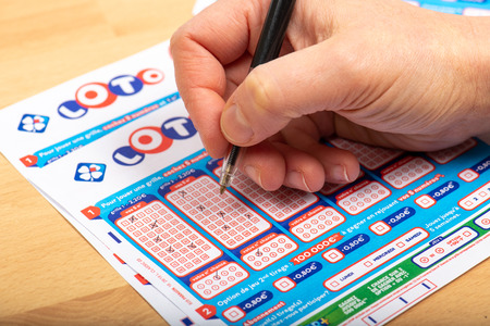 Paris, France -  November 21, 2019 : Closeup of aperson filling a lotto grid ,  from the society FDJ  (La francaise des jeux)のeditorial素材