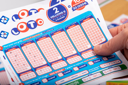 Paris, France -  November 21, 2019 : Closeup of french grids of lotto ,La francaise des jeux, in a person's handのeditorial素材