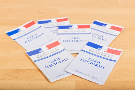 France, Paris, November, 14, 2019, French electoral voter cards official government allowing to vote paper on wooden background, Franceのeditorial素材
