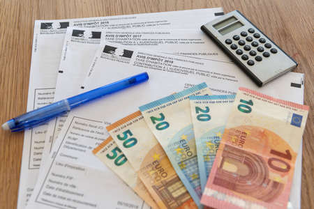 Paris, France - November 15, 2018 : The various French taxes return and banknotes in eurosのeditorial素材