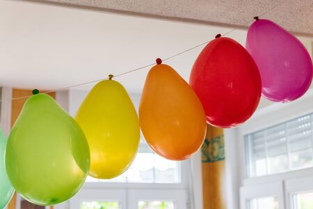Multicolored inflatable balloons in a house for a party