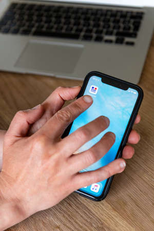 Paris, France - June, 2020 : Person using the stop covid app on a smartphone. The StopCovid app...