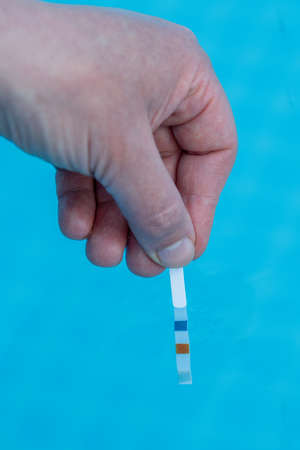 Check the pH of a private swimming poolの写真素材