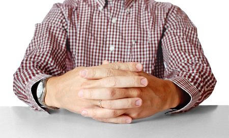 Mens hands sitting opposite at the tableの写真素材