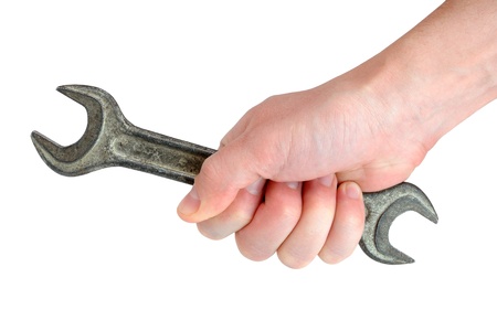 Old used wrench in handの写真素材