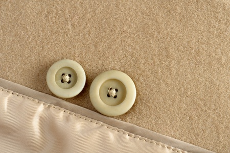 Two buttons on wool fabricの写真素材
