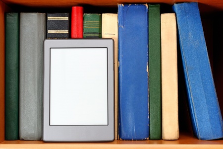 Ebook and old books on bookshelf