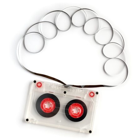 Old audio cassette with tape isolated on white backgroundの写真素材