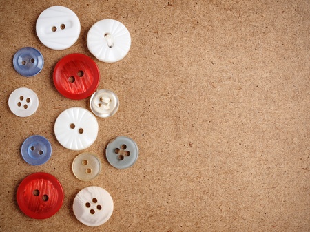 Buttons on cardboard background