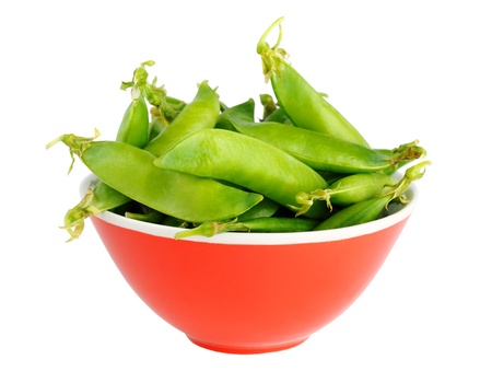 Peas in bowl isolated on white backgroundの写真素材