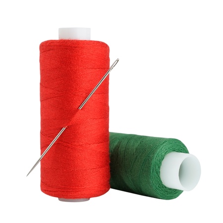 Spools of thread and needle isolated on white background