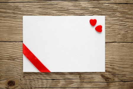 Valentine card with two hearts and ribbonの写真素材